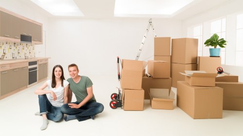 Professional movers assisting with packing in London
